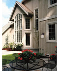 Solid Exterior Wall Lantern Featuring Slick Weathered Patina Cast Aluminum Body Plus Crisp Seeded Glass Panes For Front Porches And Driveways near entryway.
