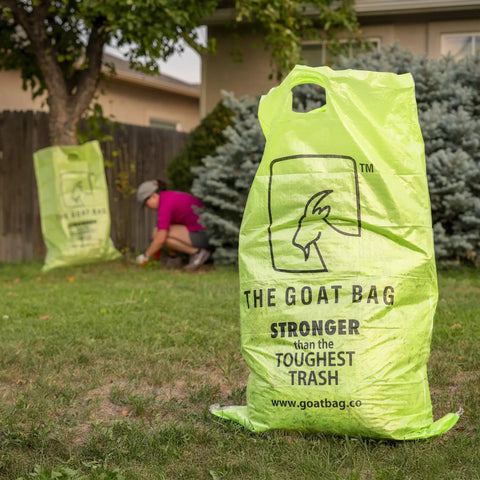 Ultimate Heavy Hitter Contractor Bags Built Like A Tank For Renovation Debris And Yard Waste 42 Gallon Tear Resistant Polypropylene Reusable Jobsite Trash Bags 10 Pack in bright green, with one bag in focus and another behind.