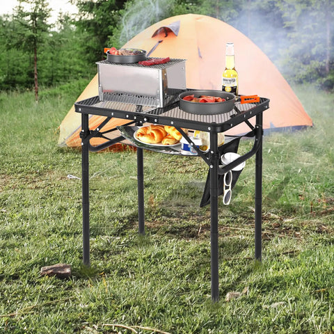 Foldable Grill Table For Outdoors, Lightweight Aluminum Frame, Height Adjustable From Low To Tall, Dense Mesh Desktop shown at campsite