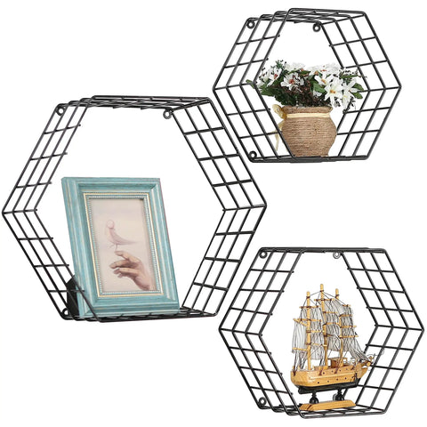 Matte Black Hexagonal Wire Mesh Floating Shelves Set Of 3 Wall Mounted Display Rack For Bedroom Or Office with plants and a frame.
