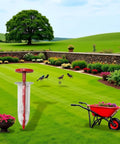 Compact Handheld Seed Spreader For Precise Sowing In Lawns, Gardens And Planters displayed in a lush garden setting.