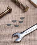 Thinking Process: crankshaft key set with metal half-moon keys and bolts on woven mat, for two-stroke engines