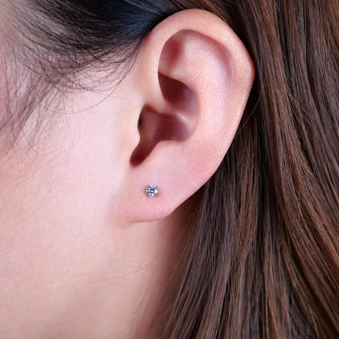 Nailed It 20G Titanium Screw Back Earrings For Sensitive Ears Men Women, shown on ear, featuring silver-tone titanium design.