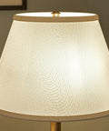 Close-up of linen shade on Spyglass Table Lamp With Antique Brass Finish Dope Retro Modern Classic Vibe Linen Shade 30.5 Inch Tall 17 Inch Wide