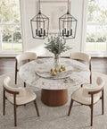 Built Different 53 Inch Round Dining Table Featuring Removable Lazy Susan Gold Ring Faux Marble Top with solid wood pedestal and chairs.