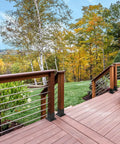 Deck with Beefy 4x4 Post Anchor Base With 3.6 X 3.6 Inch Inner Size, Heavy Duty Post Brackets, surrounded by autumn trees