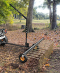 60 Inch Tow Behind Dethatcher for Lawn and ATV, Heavy Duty Lawn Rake with 24 Spring Steel Tines in use