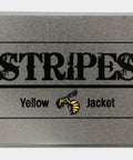 STRIPES Yellow Jacket metal canister packaging with a silver finish and bold black lettering.