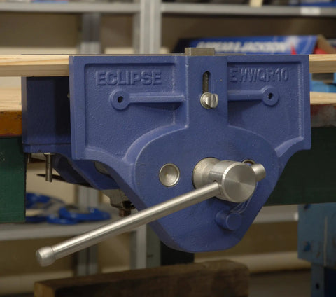Beefy 7 Inch Quick Release Woodworking Vise with heavy duty cast iron body mounted on workbench, grey finish