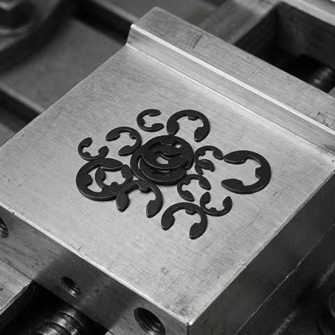120 Piece External E Clip Retaining Ring Set M1 5 To 10mm Beryllium Bronze Open Design Circlips on metal surface