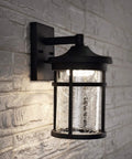 Slick One Light Outdoor Wall Lantern With Integrated Led Sconce For Backyard Or Patio Built Like A Tank, black iron finish with seeded glass.