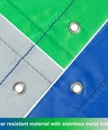 Close-up of swing set replacement tarp 52 x 90 inches, green, gray, and blue colors, with stainless metal holes for playset canopy.