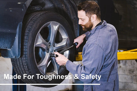 Mechanic uses One Half Inch Drive Dual Direction Click Torque Wrench Pro Grade Tool, 15 To 150 Ft-Lb Range on car wheel