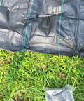 50 Pack Four Point Three Inch Plastic Garden Stakes For Weed Barrier And Landscape Edging Ground Anchors on grass