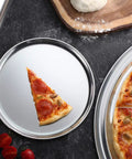 Pepperoni pizza slice on Pro Grade Restaurant Aluminum Pizza Pan 14-Inch Coupe Style Baking Tray, highlighting even heat.