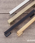 Brushed Antique Brass Cabinet Pulls 5 Inch Drawer Handles 10 Pack Solid Hardware showing four handles in various metal finishes on wood.