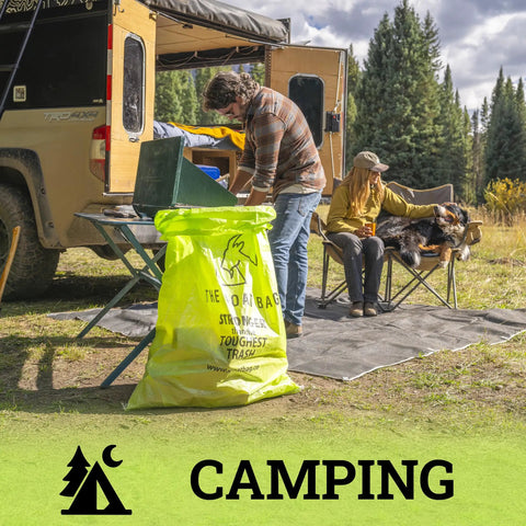 Ultimate Heavy Hitter Contractor Bags Built Like A Tank For Renovation Debris And Yard Waste 42 Gallon Tear Resistant Polypropylene Reusable Jobsite Trash Bags 10 Pack in camping scene with people and dog.