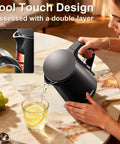 Person pouring from Compact 0.8L Travel Electric Kettle With Double Wall 304 Stainless Steel Auto Shut Off Portable Kettle