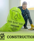 Ultimate Heavy Hitter Contractor Bags Built Like A Tank For Renovation Debris And Yard Waste 42 Gallon Tear Resistant Polypropylene Reusable Jobsite Trash Bags 10 Pack in use at a construction site.