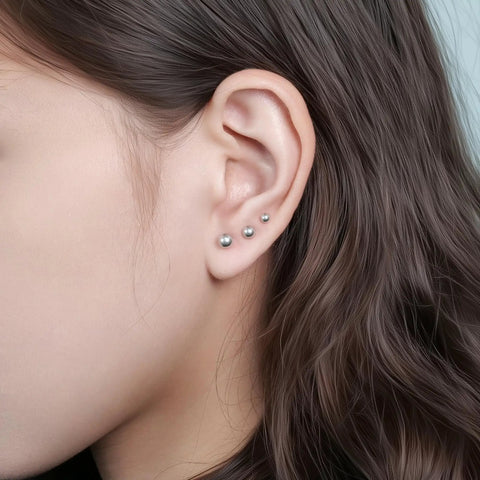 Heavy Duty Titanium Screw Back Flat Back Ball Stud Earrings For Women And Men With Hypoallergenic Nickel Free Build visible in ear.
