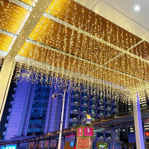 Warm White LED Icicle String Lights For Windows And Outdoor Spaces 16.4Ft 216 LEDs hanging on outdoor ceiling
