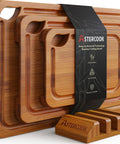 Top Shelf Deep Carbonized Bamboo Cutting Board With Sturdy Wood Storage Stand, three-piece set displayed with juice grooves.