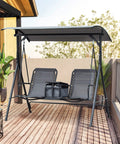 Two Seater Patio Swing Chair With Canopy And Storage Table For Backyard Hangouts on wooden deck
