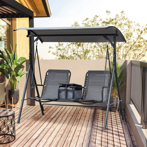 Two Seater Patio Swing Chair With Canopy And Storage Table For Backyard Hangouts on wooden deck