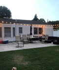 Super Tough Shatterproof Outdoor String Lights 100ft With Dimmable Vintage Edison Led Filament Bulbs illuminating a cozy patio