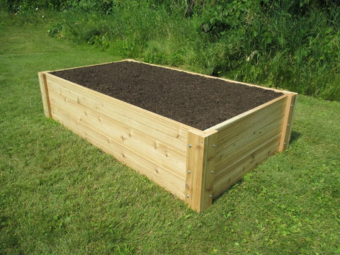 Deep Root Cedar Raised Bed Garden Kit With 16.5 Inch Depth Heavy Duty 1 Inch Cedar Deck Boards on grass
