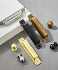 Heavy Duty 10 Pack Of Three Inch Antique Brass Cabinet Pulls With Slick Zinc Alloy Build, various styles on gray surface.