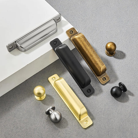 Heavy Duty 10 Pack Of Three Inch Antique Brass Cabinet Pulls With Slick Zinc Alloy Build, various styles on gray surface.