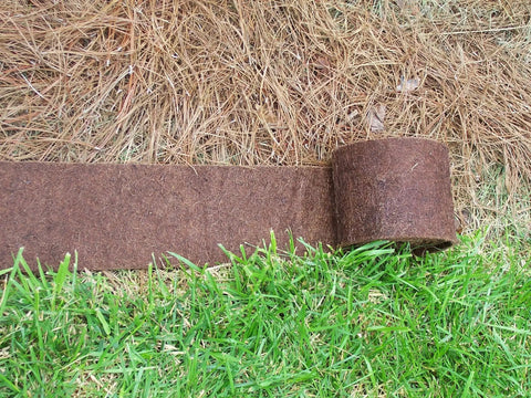 Border Protection Edging Weed Mat 10 Ft Long By 9 In Wide Brown Landscape Fabric laid between grass and pine straw