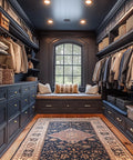 Luxury closet with organized shelves, a cozy bench, and elegant decor contrasting dark walls with light textiles.