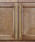 Top Tier Solid Brass Cabinet Pulls With Brushed Gold Finish on wooden cabinet doors, showcasing modern sleek design and 320mm spacing.