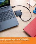 2TB Portable SSD With USB 3 For Quick File Transfers On The Go connected to a laptop for data transfer, ideal for PC and Mac.