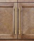 No Nonsense Solid Brass Cabinet Pulls With Sleek Brushed Gold Finish on wooden cabinet doors, 11 1/4 Inch spacing.