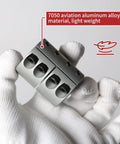 Front view of aluminum 14mm-to-14mm rigid shaft coupling with split clamp, held by gloved hands