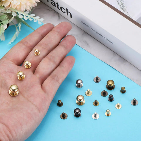 Hand showing Ball Head Stud Rivet Set 4 5 6 7 8 mm Head Diameter Back Screws 50 Pack Silver Tone Zinc Alloy Button Nipple Rivets