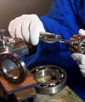 Technician inspecting MR84-2RS deep groove ball bearings, 4mm inner dia, 8mm OD, 3mm bore, double sealed chrome steel, Z2 10pcs.