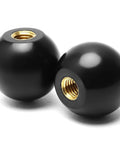 Close-up of black Bakelite knobs with 3/8-16 threads, part of Five Pack 3/8-16 Threaded Ball Knobs For Lawn Mowers 1-3/8 Inch Diameter Bakelite Thermoset Handle Black