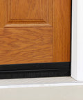 Door Sweeps - Aluminum & Brush - Brush Sweeps for Gaps Up to 1” - Black Trim with Black Brush installed on wood door