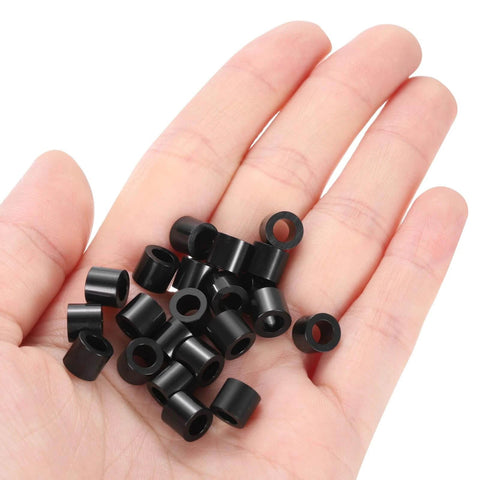 Hand holding 100pcs Nylon Round Spacers 4mm ID, 7mm OD, 6mm Height Screws Spacers Without Threaded, Plastic Spacer for M4 Screws, Black