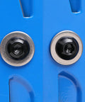 Close-up of Five Sixteenth By Eighteen Threads Per Inch Button Head Socket Cap Screws showing black oxide hex drive on blue surface.