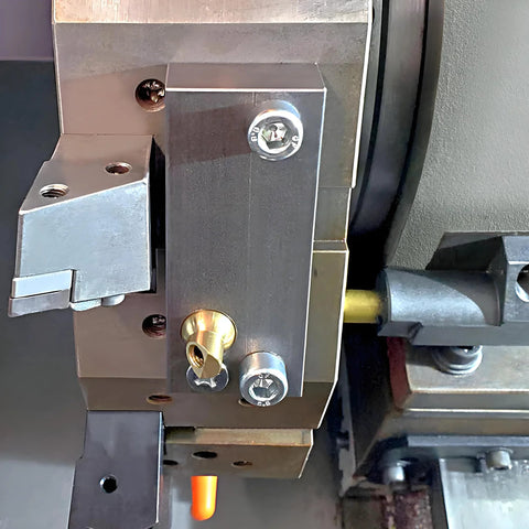Brass Ball CNC Nozzle 12mm Diameter, 27mm Length with Slanted 4mm Hole installed in machinery, part of high pressure coolant system