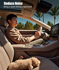 Man driving a car with a sleeping dog beside him, promoting a quiet driving experience.