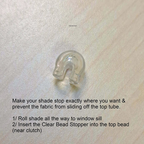 Clear bead stopper for shades on wooden surface
