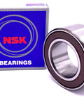 Compact angular contact double row bearing 30BD40, 30x55x23 mm, sealed and Japan-made, with blue NSK box in background.