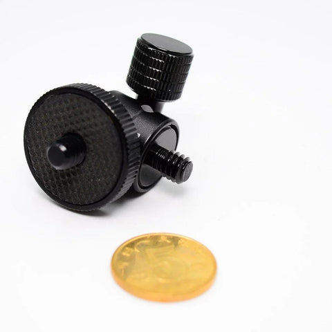 Compact Mini Ball Head Tripod Mount With One Quarter Inch Screw Connector for Cameras and DSLRs, shown beside a coin for size reference.