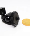 Compact Mini Ball Head Tripod Mount with One Quarter Inch Screw Connector next to coin, supports 360 degree rotation